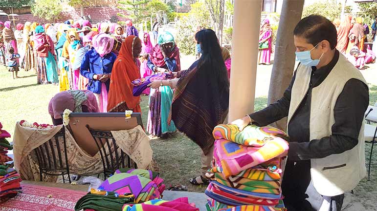 Stree Shakti URJA: distributing blankets and food rations to Bhil tribal women